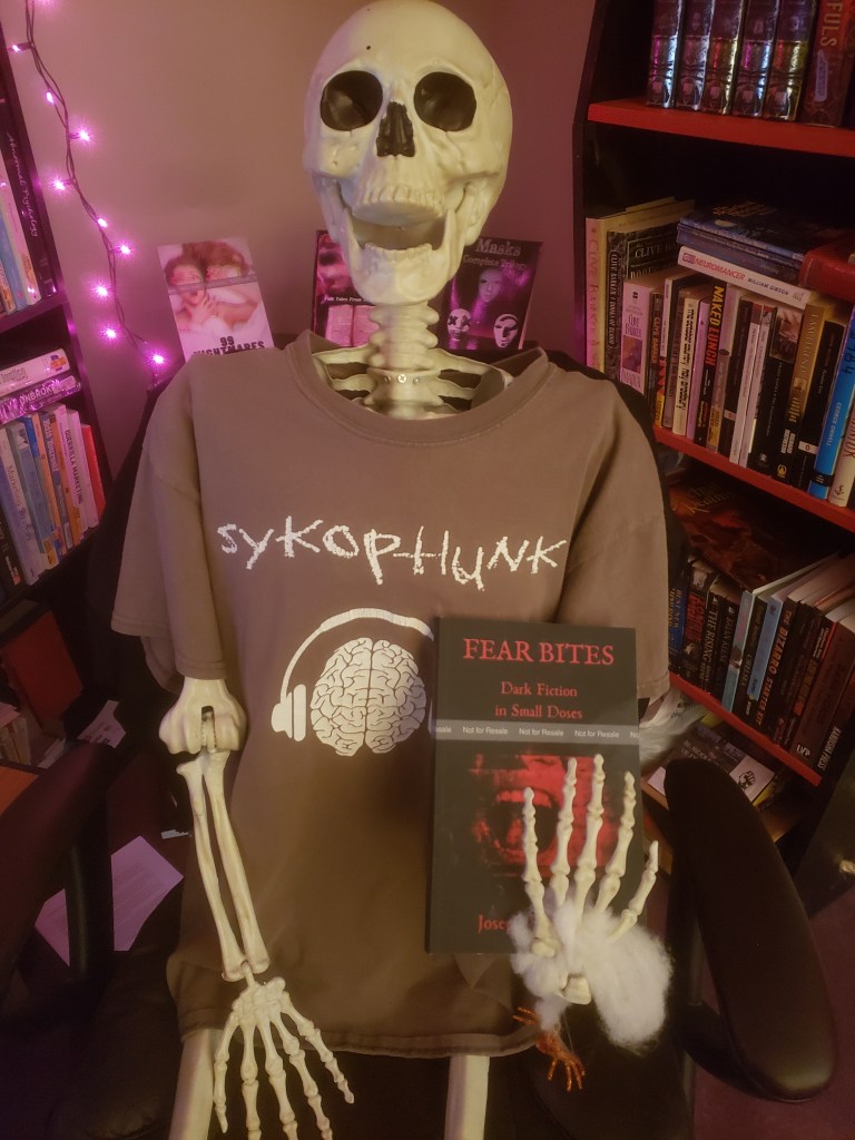 Marvin the skeleton holding the new book by Joseph VanBuren entitled Fear Bites: Dark Fiction in Small Doses